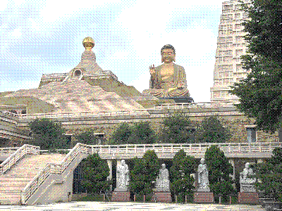 An image of the Buddha Museum at Fo Guang Shan Monastery. There is a large golden Amitabha Buddha in the background.